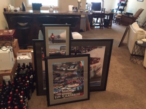 My racing photos. Waiting for the wine to get out of the way so they can find a home on the wall.