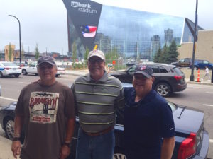 L-R, the lineup of Noffke, Wilber, and Ricker in front of the new stadium (photo by McCord)